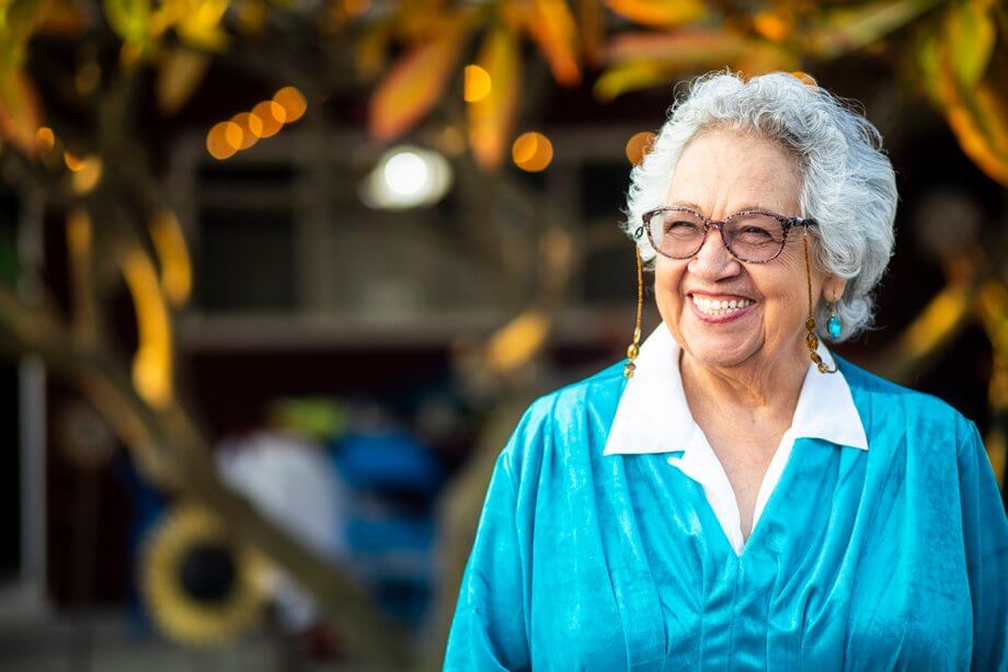 mature woman in glasses smiling