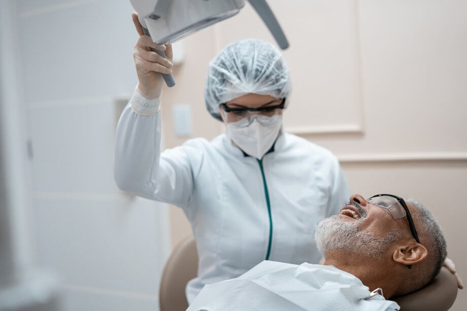 dental professional prepares patient for dental procedure